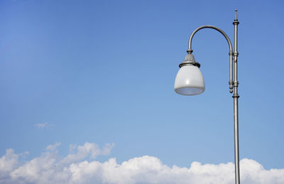 Low angle view of street light against sky