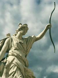 Low angle view of statue against sky