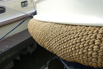 Close-up of hat hanging on rope