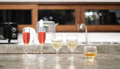 Close-up of wine glasses on table