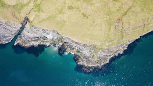 High angle view of rock formation in sea