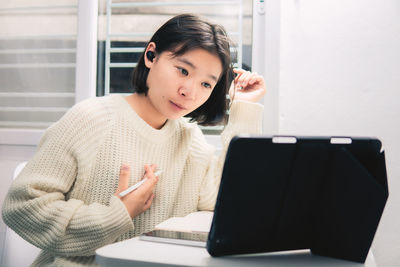 Young woman using mobile phone