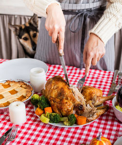 Cropped hand of person preparing food