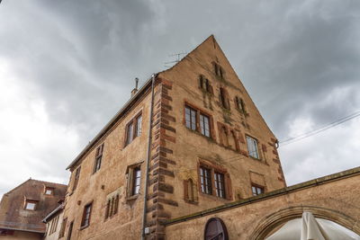 Low angle view of old building against sky