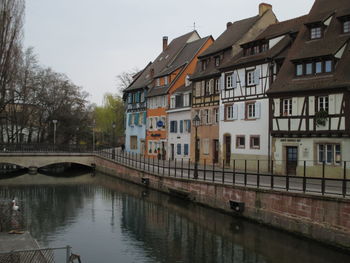 Houses by canal in city