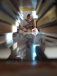 Midsection of woman holding illuminated lighting equipment