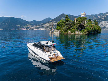 Boat sailing in sea against sky