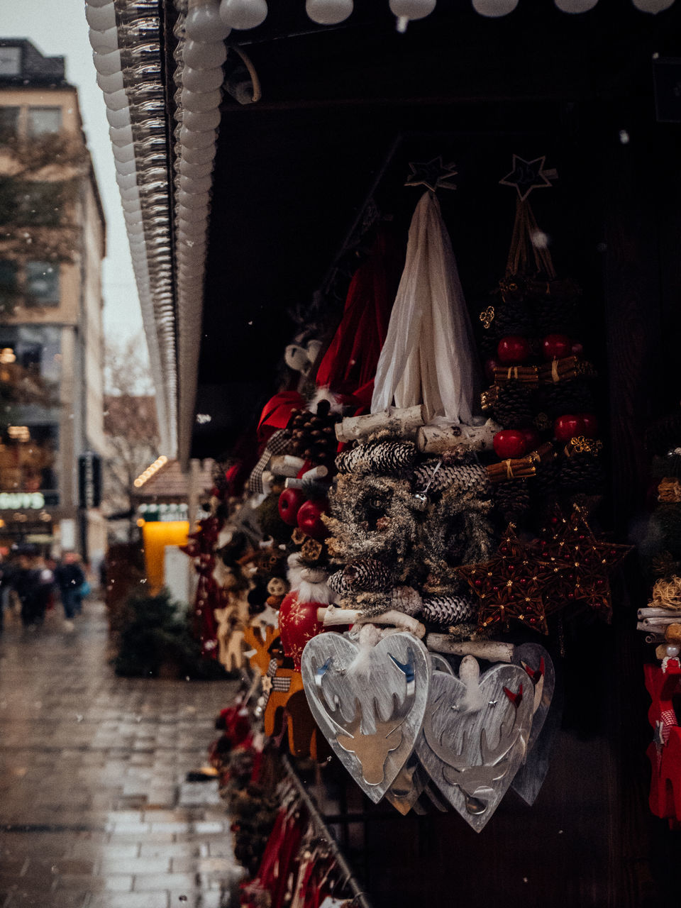 architecture, city, celebration, hanging, decoration, tradition, holiday, christmas, built structure, market, retail, street, christmas decoration, building exterior, travel destinations, outdoors, no people, religion, night