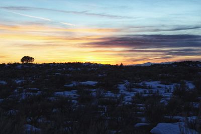 Scenic view of landscape against sky during sunset