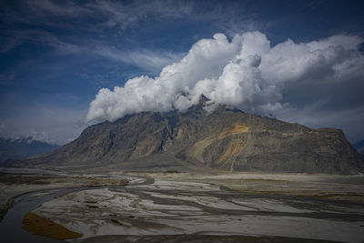 Scenic view of volcanic landscape against sky