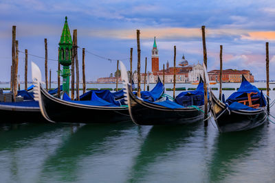 Boats moored at harbor