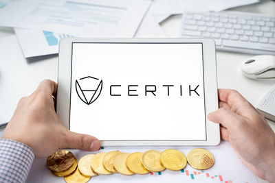 Midsection of person using mobile phone