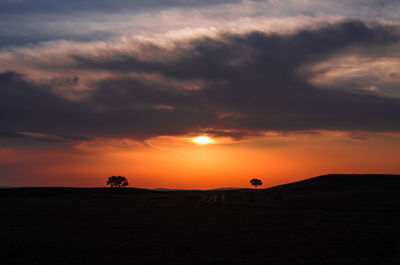 Scenic view of silhouette landscape against sky during sunset