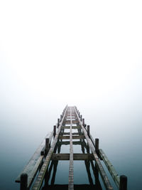 High angle view of pier on lake against sky