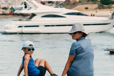 Mother and son enjoying vacation at beach