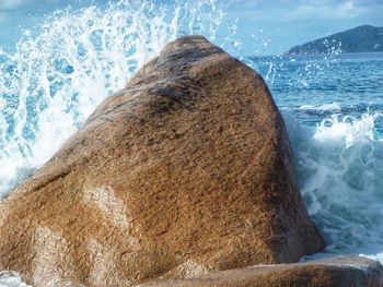 Sea waves splashing on rocks