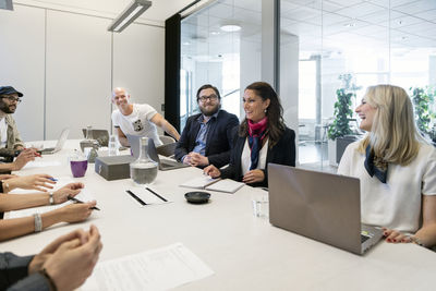 Coworkers in board room