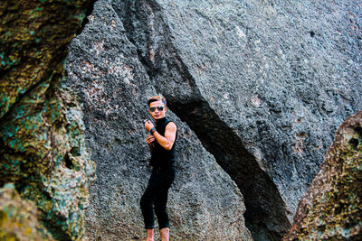 Full length of woman on rock