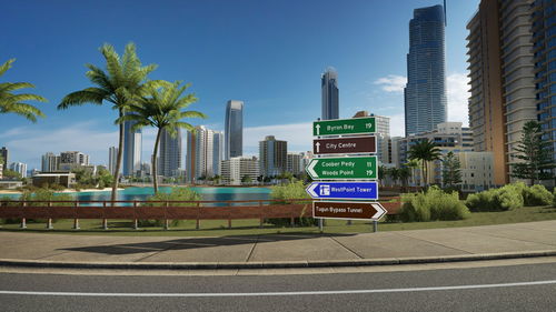 View of city street and buildings against sky