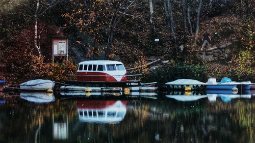 Boats moored in lake