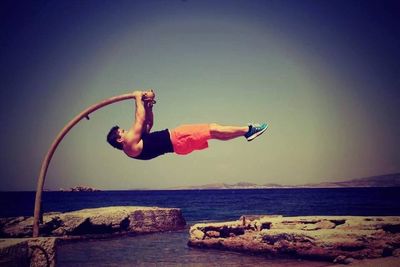 Woman jumping into the sea