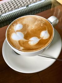 Close-up of cappuccino on table