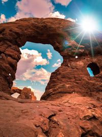 Low angle view of rock formation against sky