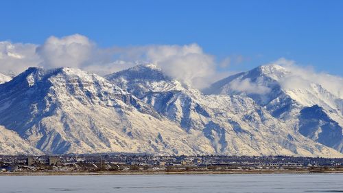 Scenic view of snowcapped mountains against sky