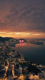 High angle view of illuminated buildings against sky during sunset