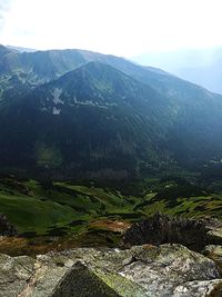 Landscape with mountain range in background