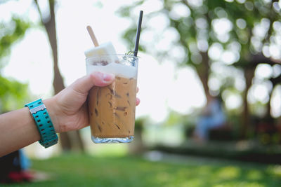 Close-up of hand holding drink