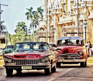 Car on street against buildings in city