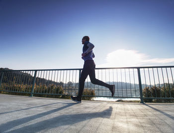 Full length of man on bridge against sky