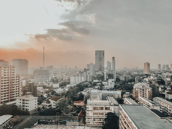 High angle view of buildings in city against sky