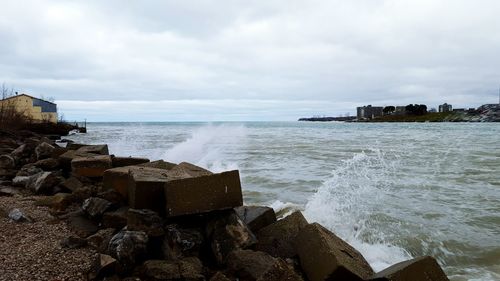 Scenic view of sea against cloudy sky