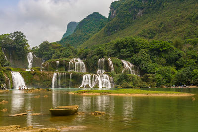 Scenic view of lake with mountain in background