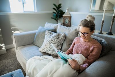 Woman sitting on sofa