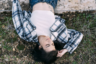 High angle view of man lying on field