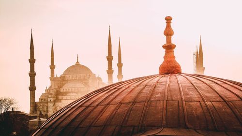 Low angle view of mosque against sky