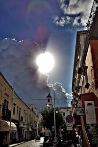 City street amidst buildings against sky