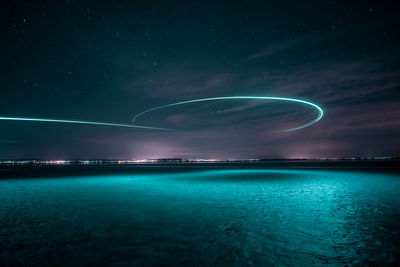 Scenic view of sea against sky at night