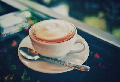 Close-up of coffee cup on table