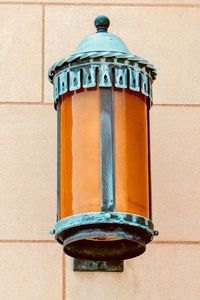 Close-up of lamp against wall