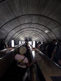 People standing on escalator