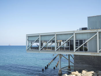 View of built structure against sea and sky