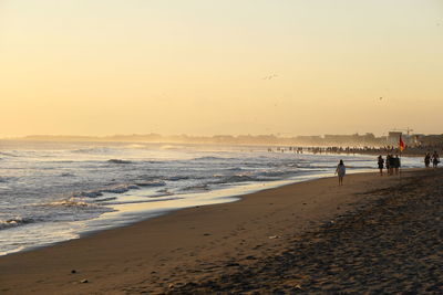 Scenic view of sea against clear sky during sunset