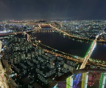 High angle view of illuminated cityscape at night