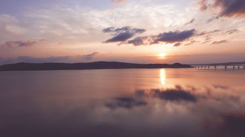 Scenic view of calm sea at sunset