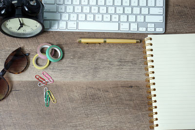 High angle view of clock on table