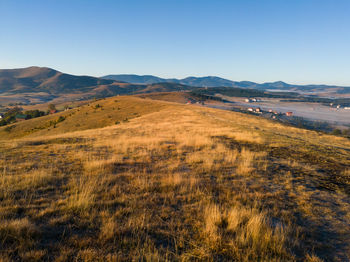 Scenic view of landscape against clear blue sky